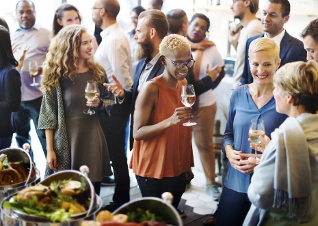Guests networking with drinks at a corporate event